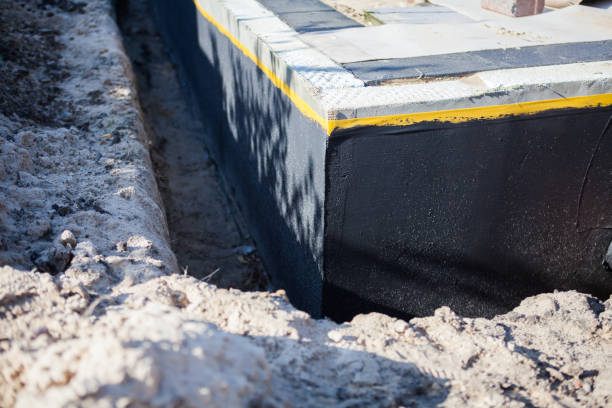 Professional Basement Waterproofing technician working in Piffard, NY
